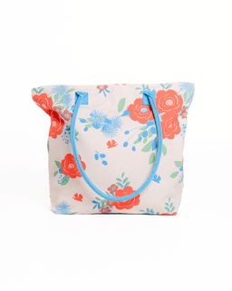 Floral tote bag with blue handles on a white background