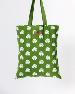 Green tote bag with an allover white shell print and matching straps.