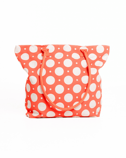Polka dot tote bag with white dots on a pink background