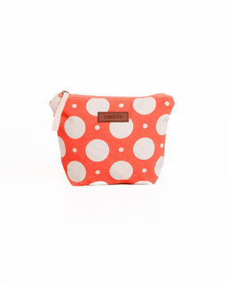 Polka dot pouch with a visible brand label on a white background