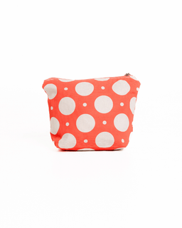 Polka dot pouch with white dots on a coral background