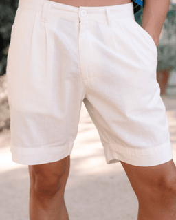 White shorts worn by a person with a blurred background