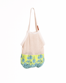 Beige tote bag with floral pattern on a white background