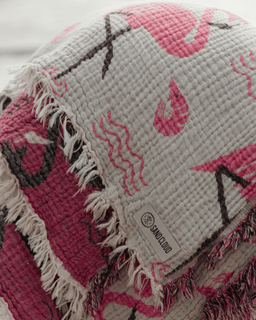 Textile with pink and black patterns on a white background