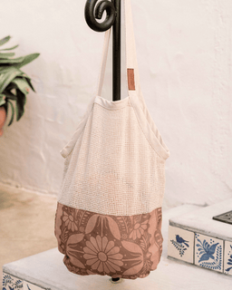 Tote bag with floral pattern on a white surface