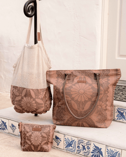 Set of brown bags with floral patterns on a decorative surface.