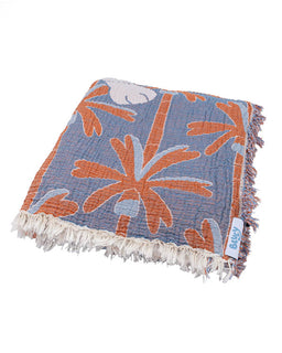 Floral patterned blanket with fringes on a white background