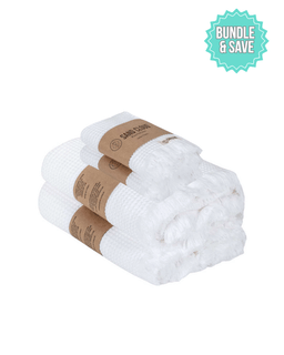 Stack of white towels with brown paper wrapping on a white background, featuring a 'Bundle & Save' label.