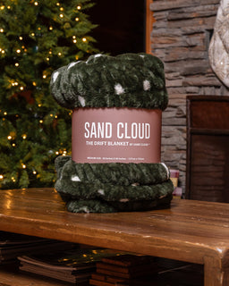 Drift Blanket sitting on the table with a sleeve
