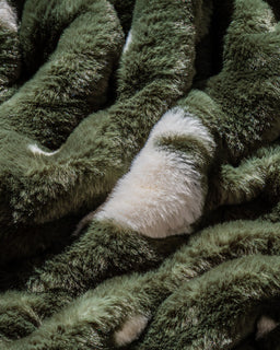 Close up texture shot of pine green chistmas tree drift blanket