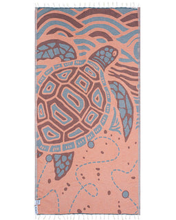 Towel with a turtle design on a pink background
