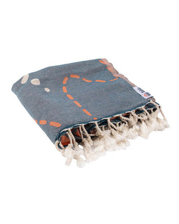 Blue towel with orange and white patterns on a white background