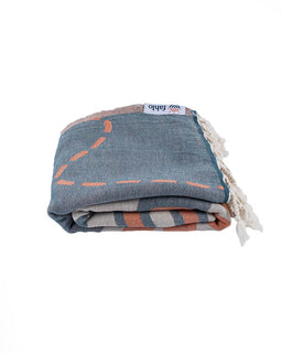 Folded fabric with geometric pattern on a white background