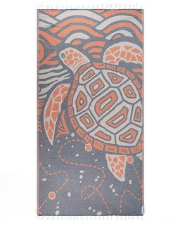 Towel with a turtle design in orange and gray on a white background