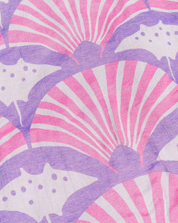 A close-up of a fabric pattern featuring stylized pink and white seashell and starfish motifs in lavender purple.