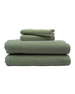 Stack of green towels on a white background