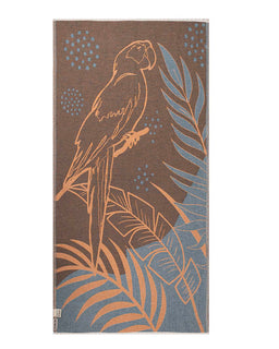 Towel with parrot and leaf design on brown and blue background