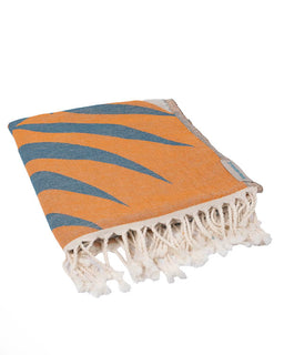 Orange and blue striped towel with white fringes on a white background