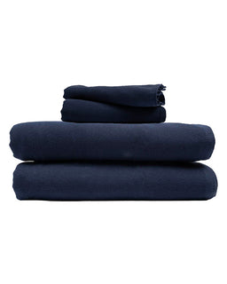Stack of navy blue towels on a white background