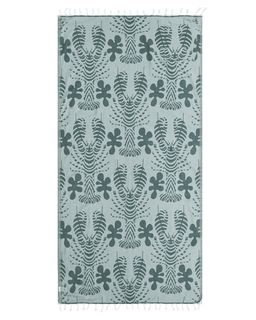 Patterned towel with geometric design on a light blue background