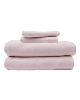 Stack of pink towels on a white background