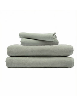 Stack of folded towels on a white background