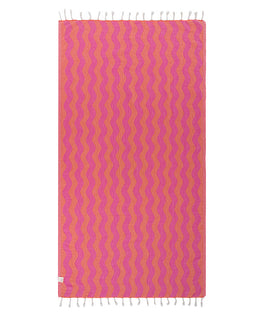 Towel with pink and orange wavy pattern on a white background