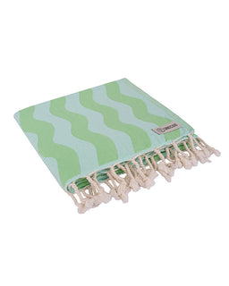 Green and white striped towel with tassels on a white background