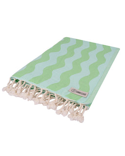 Green and white patterned towel with tassels on a white background