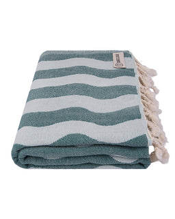 Teal and white striped towel with tassels on a white background
