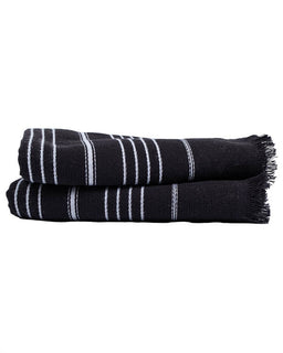Two folded black towels with white stripes and fringed edges, stacked on a plain white background.