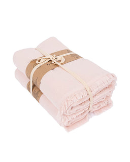 Two folded light pink fringed towels tied together with a brown paper band and cream string, shown on a plain white background.