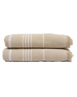 Two folded beige towels stacked on a white background, each with thin white vertical stripes and fringed edges.