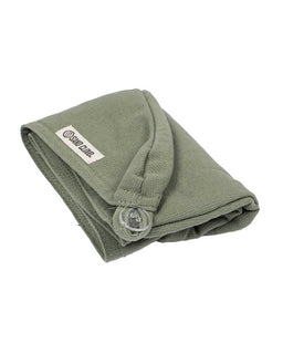 folded green hair towel on white background