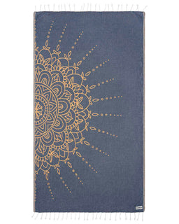 Blue towel with gold mandala design on a white background