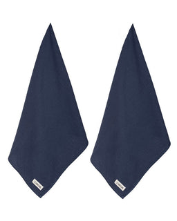 Two navy blue towels on a white background