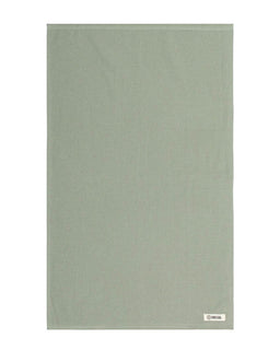 Solid green towel on a white background