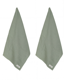 Two green towels hanging against a white background