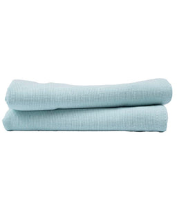 Two folded light blue towels on a white background