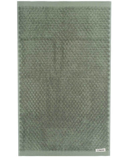 Green textured hand towel on a white background