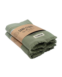Green towel with a brown paper wrap and visible branding on a white background