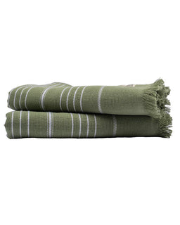 Two green striped towels stacked on a white background