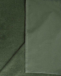 Close-up of green fabric with a subtle pattern