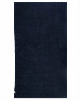 Navy blue towel on a white background