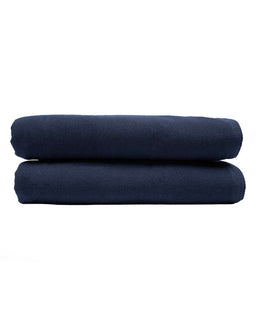Two navy blue folded towels on a white background