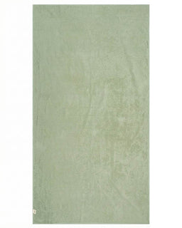 Green towel on a white background