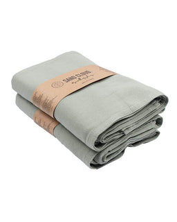 Folded light gray towel with a brown label on a white background