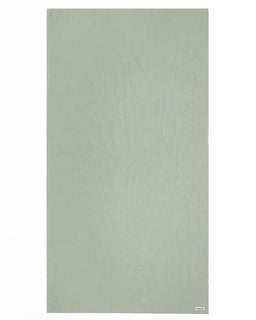 Solid light green towel on a white background