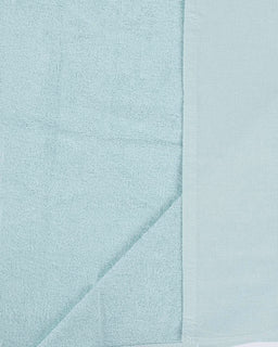 Light blue towel with a subtle pattern on a light gray background