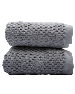 Two folded gray textured towels stacked on a white background